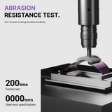 Abrasion resistance test with a drill bit and metal sample on a gray background