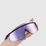 Hand holding a pair of futuristic goggles with purple lenses on a light gray background