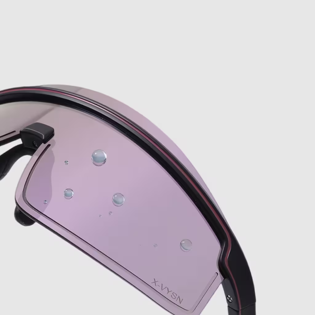 Close-up of a pink visor with black frame on a light gray background