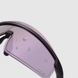 Close-up of a pink visor with black frame on a light gray background