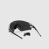 Black sunglasses with a clear lens on a light gray background