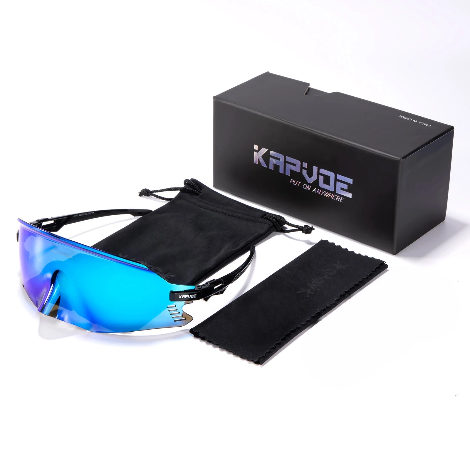 Blue-tinted sunglasses with black carrying case and UNBOUND branded box on a white background