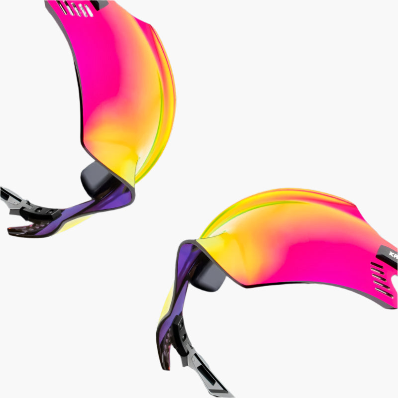 Colorful frameless goggles with 'UNBOUND' branding on a dark background