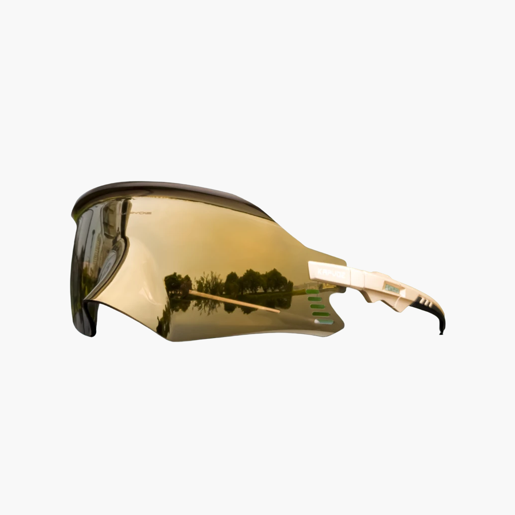 Gold-tinted sunglasses with a reflective surface on a white background