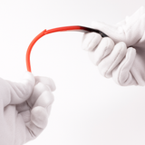 hands banding a sunglasses frame in a white background