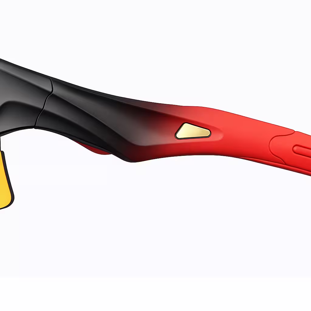 Close-up of a red and black object with a gold triangle on a white background