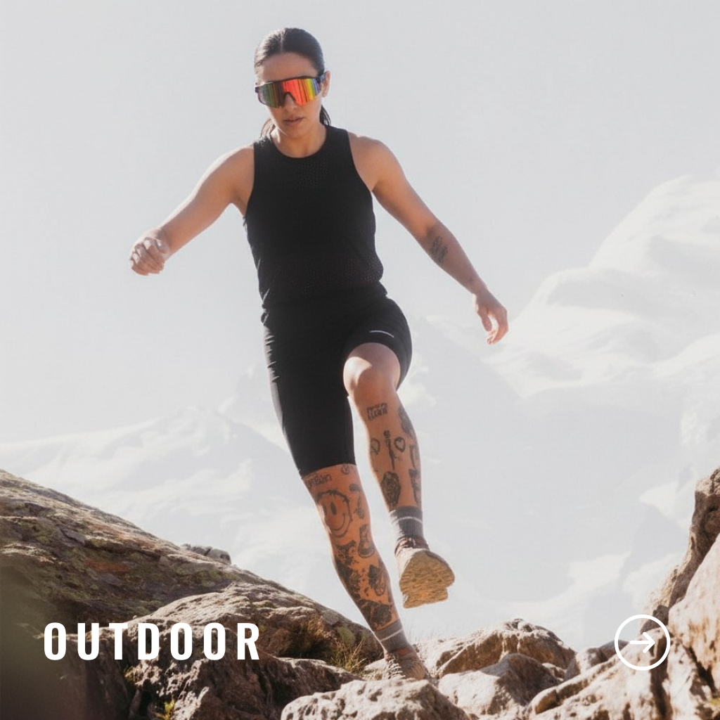 Woman in black athletic wear and sunglasses running on a rocky surface with snow in the background, labeled 'Outdoor'.
