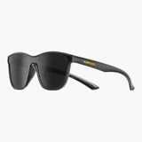 Black sunglasses with yellow text on a white background, featuring the brand 'UNBOUND'.