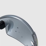 Close-up of a gray helmet visor with water droplets on a light gray background