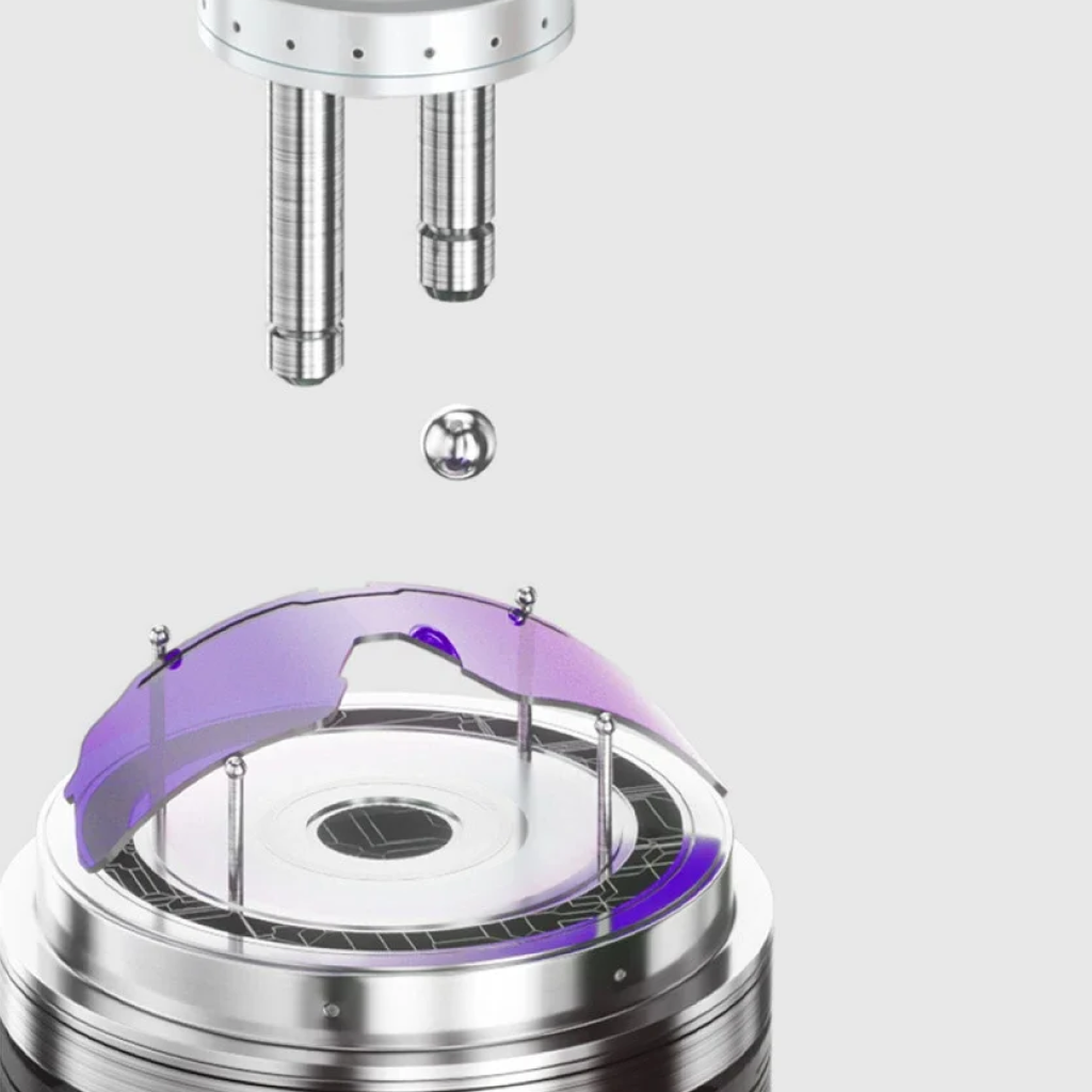 Close-up of a metallic device with a purple component on a white background