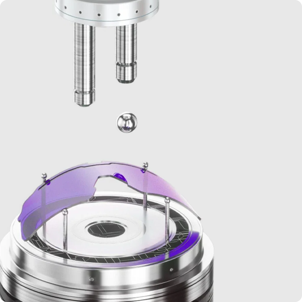 Close-up of a metallic device with a purple component on a white background