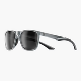 Sunglasses with gray frame and dark lenses on a white background